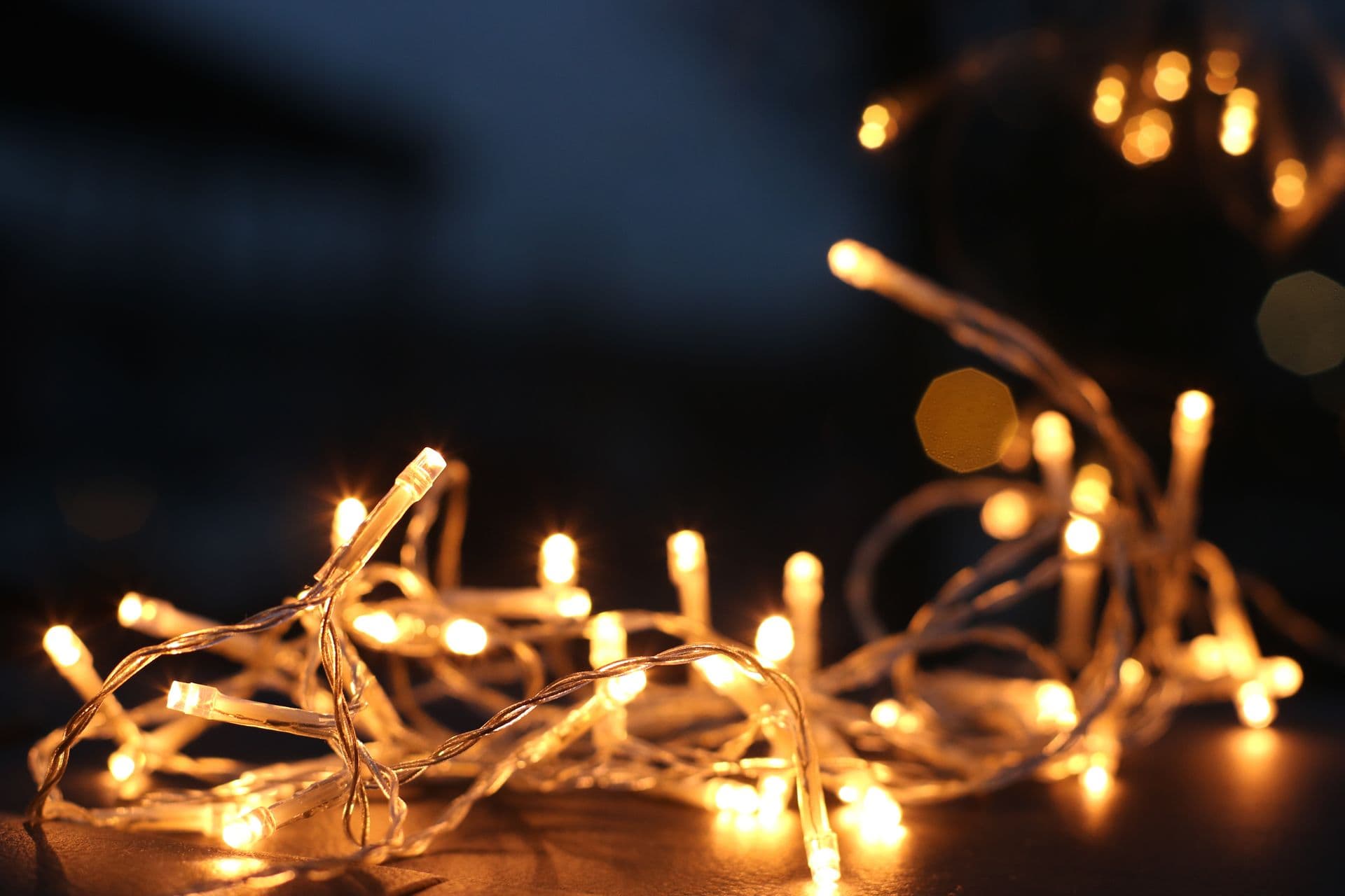 Golden city lights creating depth behind customer data cards